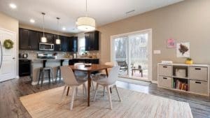 kitchen and dining room combination with a 4 chairs dining set on a contemporary rug