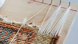 Running and adding a new fringe to a worn Persian rug