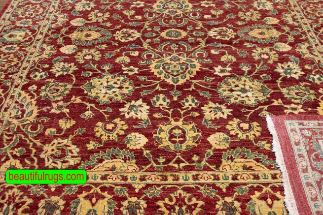 Handmade floral Pakistani wool area rug in red color. Size 8x10.4