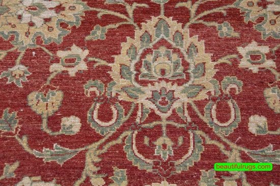 Handmade floral Pakistani wool area rug in red color. Size 8x10.4