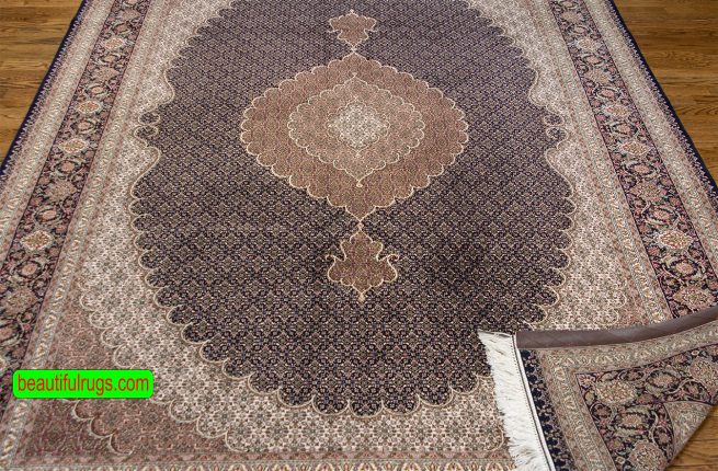 Handmade Persian Tabriz rug with black and brown colors with a large center medallion. Size 6.8x10.