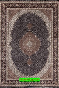 Handmade Persian Tabriz rug with black and brown colors with a large center medallion. Size 6.8x10.