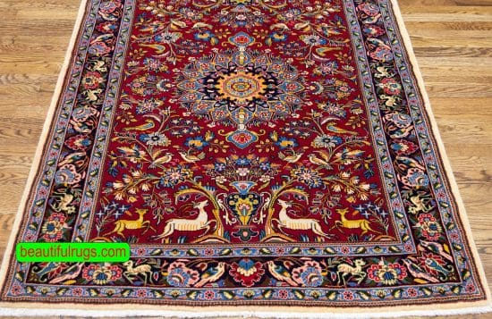 Handmade Persian Sarouk area rug with birds and animal motifs in red color. Size 4x5.10.