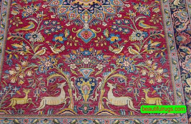 Handmade Persian Sarouk area rug with birds and animal motifs in red color. Size 4x5.10.