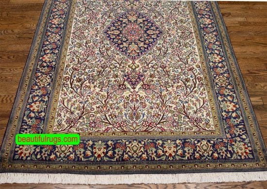 Hand knotted floral Persian Qum wool and silk rug in beige and navy blue color. Size 4.8x7.1.