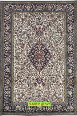 Hand knotted floral Persian Qum wool and silk rug in beige and navy blue color. Size 4.8x7.1.