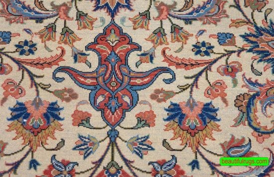 Handmade floral Persian Sarouk wool area rug with beige and red colors. Size 6.9x10.