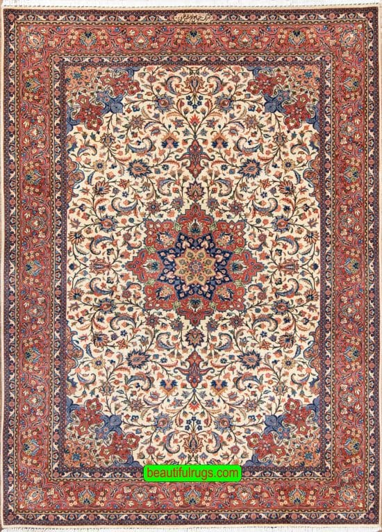 Handmade floral Persian Sarouk wool area rug with beige and red colors. Size 6.9x10.