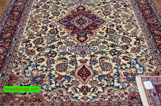 Hand knotted floral Iranian Mashad wool carpet in beige and merlot red color. Size 6.8x9.4.