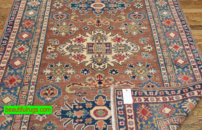 Handmade Pakistani oriental rug with Caucasian Kazak design in brown color. Size 4x6.10.