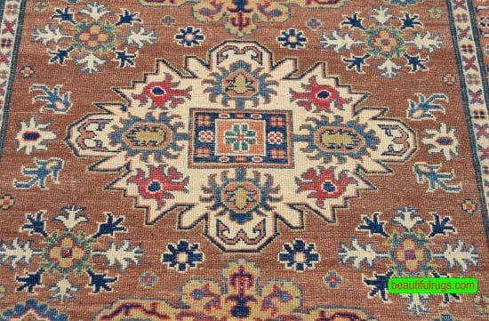 Handmade Pakistani oriental rug with Caucasian Kazak design in brown color. Size 4x6.10.