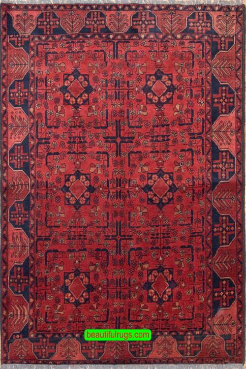 Handmade Afghan Kunduz rug in red and black color made of wool. Size is 4.10x6.7.