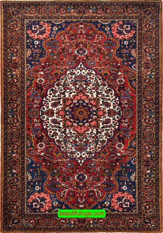 Handmade antique Persian Bakhtiari wool rug in red color. Size 5x7.8.