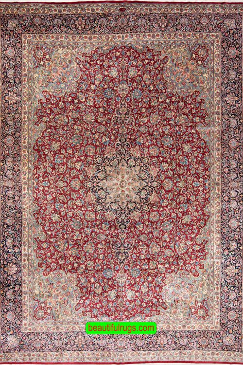 Beautiful hand knotted Persian Kerman wool rug in red and navy blue colors. Size 11.4x15.4.