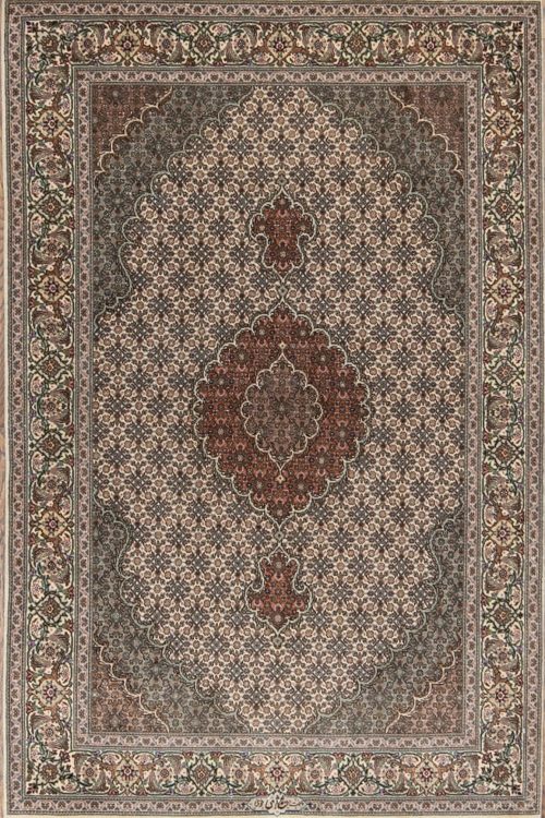 A classic design wool and silk handmade Persian carpet in beige and green colors. Size 3.5x5.3.