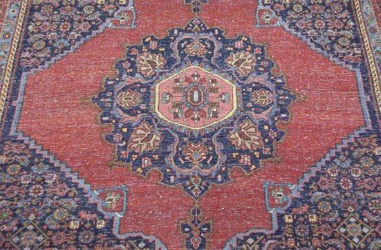 Handmade antique Persian Senneh rug, geometric and floral pattern with terracotta and navy-blue colors. Size 4.8x7.2.