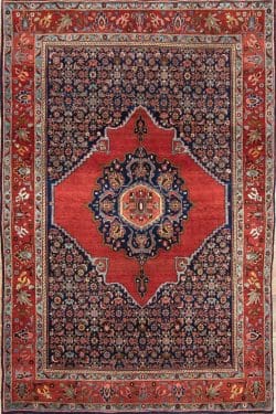 Handmade antique Persian Senneh rug, geometric and floral pattern with terracotta and navy-blue colors. Size 4.8x7.2.