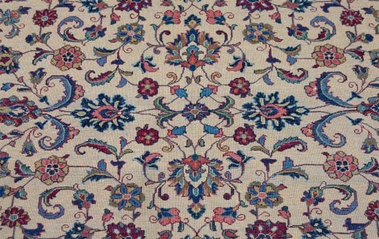 Handmade Persian Sarouk area rug with beige color in the main field and red in the borders. Size 4.2x6.8.