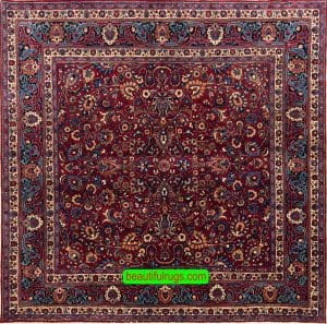 Handmade Persian Mashad square rug in red color. Size 6.10x6.7.