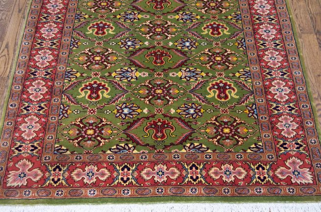 Handmade floral traditional wool Persian Sarouk wool area rug in green and red colors. Size 3.9x4.7.
