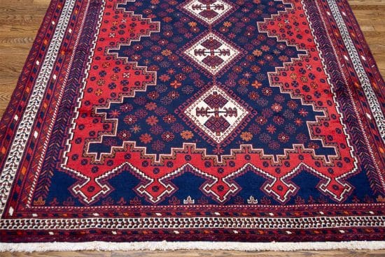 Hand knotted thick pile Persian Shiraz wool rug in geometric style and red color. Size 5.7x7.10.