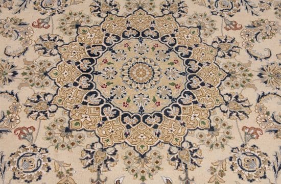 Hand knotted wool area rug floral design in beige color. Rug size 6.1x9.3.