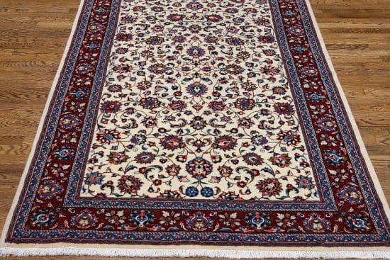 Handmade Persian Sarouk wool rug, floral design with white color in the primary field and red in the borders. Rug size 4.5x7.