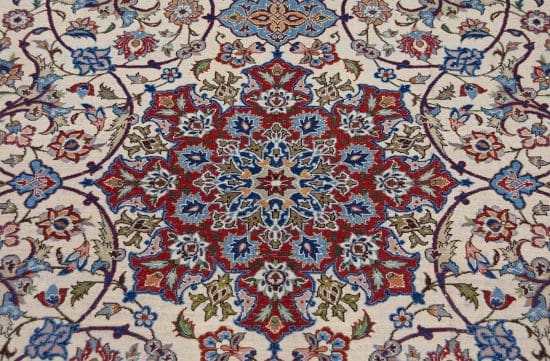 Authentic handmade antique Persian Isfahan Wool rug with beige and red colors. Rug size 5x7.