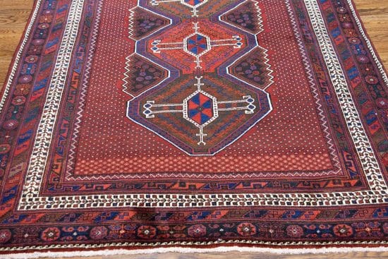 Handmade geometric style Persian Sirjan wool area rug in red color. Size 5.5x7.9.