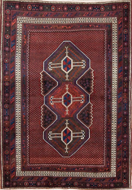 Handmade geometric style Persian Sirjan wool area rug in red color. Size 5.5x7.9.