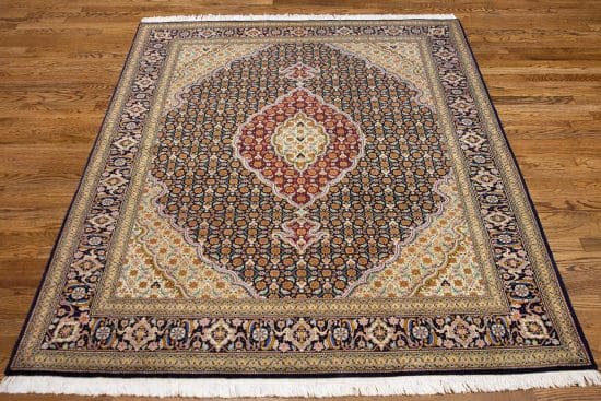 Handmade 5x6 Persian Tabriz area rug in black and burgundy.