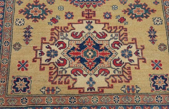 Handmade oriental rug Kazak style with Caucasian motifs in chartreuse color. Rug size 4.10x6.10.