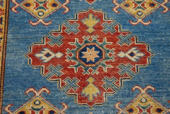 Handmade geometric style Kazak area rug in blue color. Size 3x4.5.