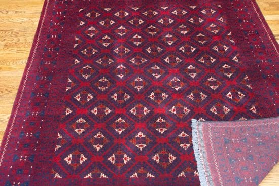 Hand knotted tribal Afghan Turkmen rug in red and navy-blue colors. Rug size 4.10x6.7.