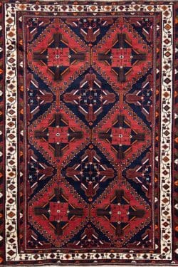 Geometric Persian carpet. Hand knotted Persian Shiraz carpet in red and navy blue colors. Rug size 4.10x7.9.