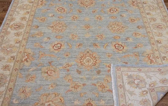 Handmade floral vintage looking Turkish style rug in blue color. Size 5.7x7.10.