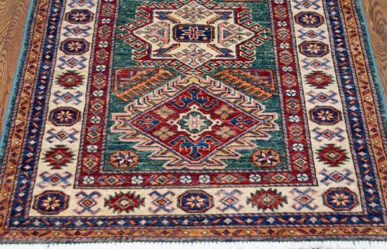 Handmade geometric style super Kazak wool rug in green color. Size 3x4.4.