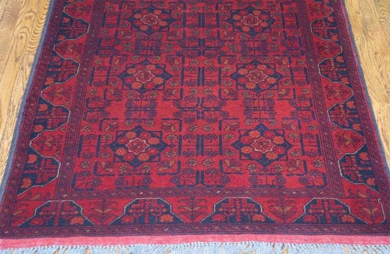 Handmade Afghan tribal wool rug in red color. Size 3.6x5.1.