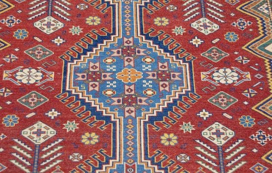 Red oriental rug. Handmade geometric style oriental rug in red and blue colors. Size 5x6.6.