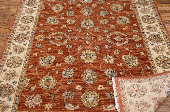 Rust oriental rug. Hand knotted wool transitional Oushak style rug made in India. Size 5.1x6.10.