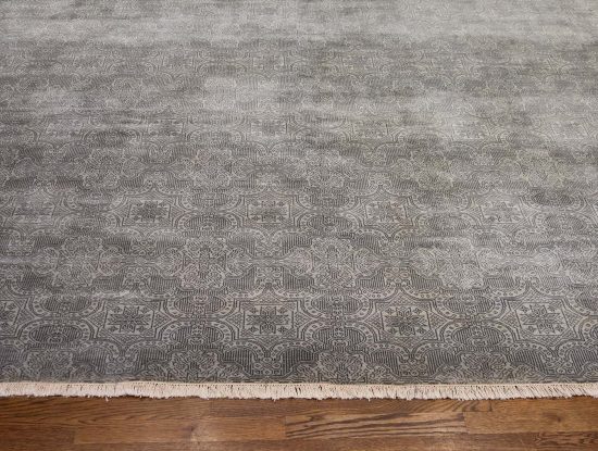 A designer contemporary rug in gray color made of wool. Size 7.10x10.1.