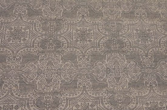 A designer contemporary rug in gray color made of wool. Size 7.10x10.1.