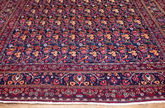 Old Persian Birjand Dorokhsh rug. Floral allover design Persian rug, multi color with navy blue background. Size 10x13.4.