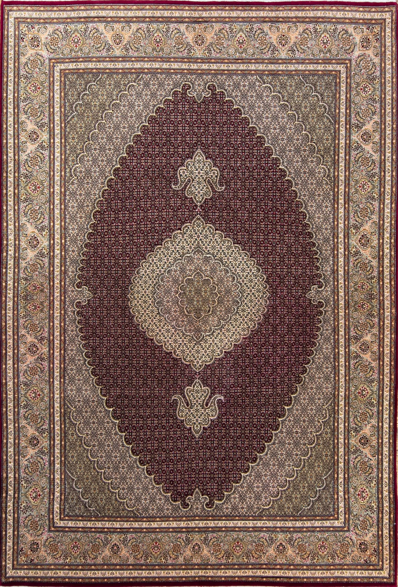 A classic style Persian Tabriz wool and silk rug in red color. Size 6.7x10.