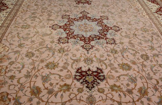 Luxury fine Persian rug. A beautiful hand knotted authentic Persian Isfahan rug made of kork wool and silk in beige, gold, and maroon colors. Size 11.9x17.