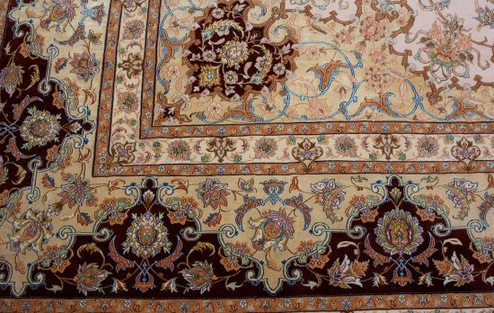 Luxury fine Persian rug. A beautiful hand knotted authentic Persian Isfahan rug made of kork wool and silk in beige, gold, and maroon colors. Size 11.9x17.