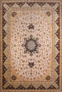 Luxury fine Persian rug. A beautiful hand knotted authentic Persian Isfahan rug made of kork wool and silk in beige, gold, and maroon colors. Size 11.9x17.