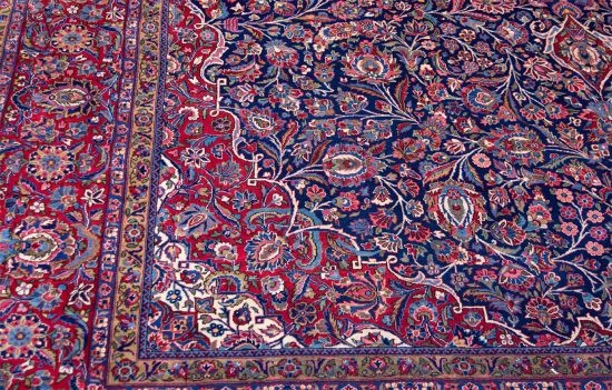 Real Persian rugs. A magnificent vintage floral Persian Kashan rug in navy blue and red border. Size 10.4x14.