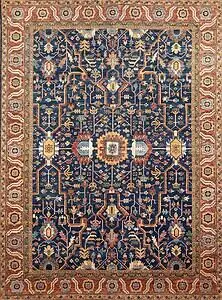 7529- Geometric rug. Beautiful handmade 10x14 navy blue and rust color geometric rug made in Pakistan.  