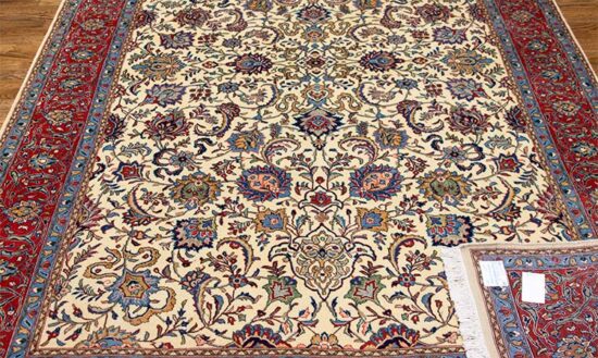 Handmade Persian Sarouk wool rug in beige and rustic red, floral and all-over design. Size 6.8x10.